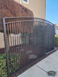 Automatic driveway gate opener installed on an arched iron picket gate by Automatic Gate Pros in San Jose, CA