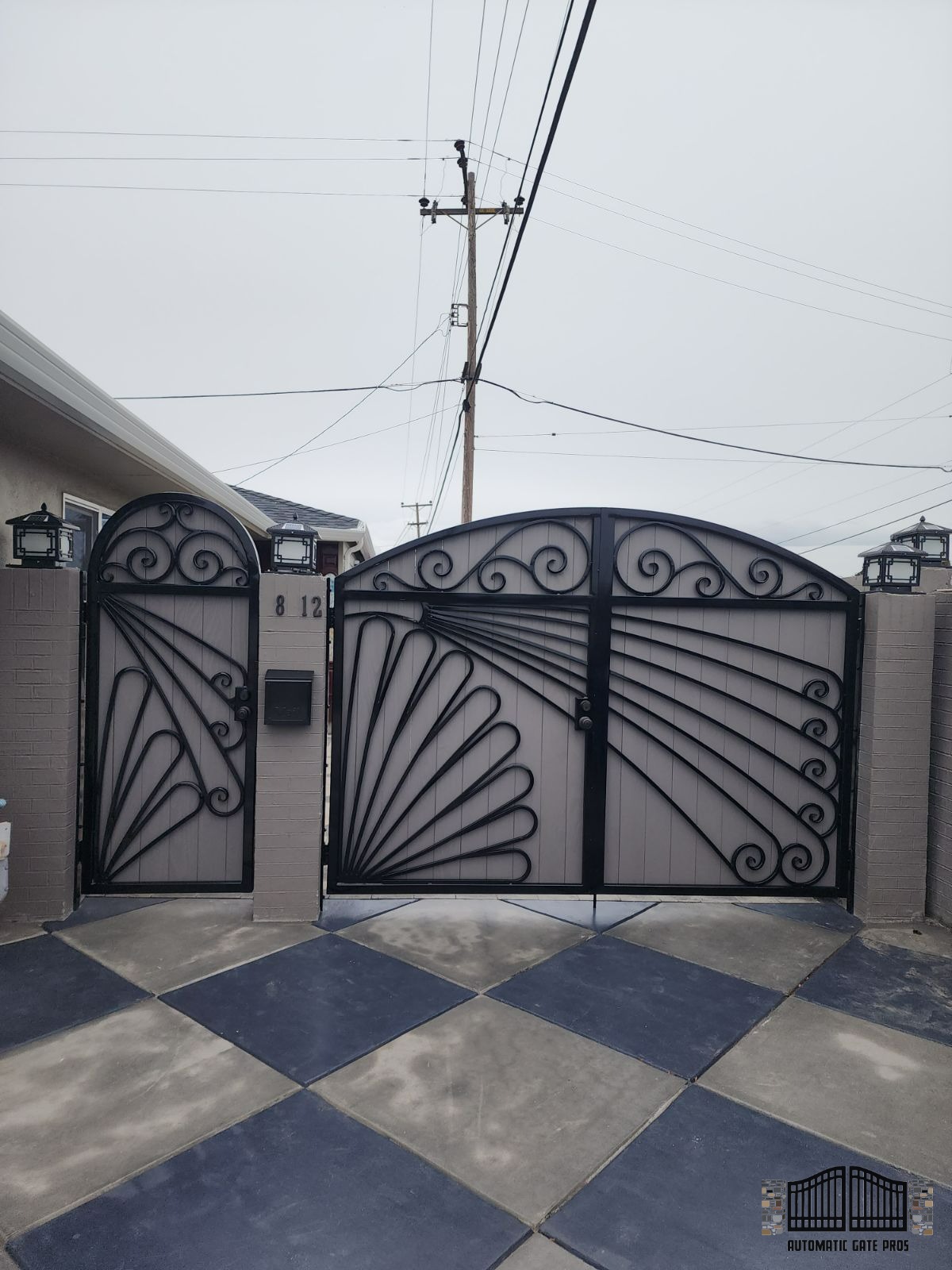 Custom ornate wrought iron double driveway gate installed by Automatic Gate Pros in San Jose, CA